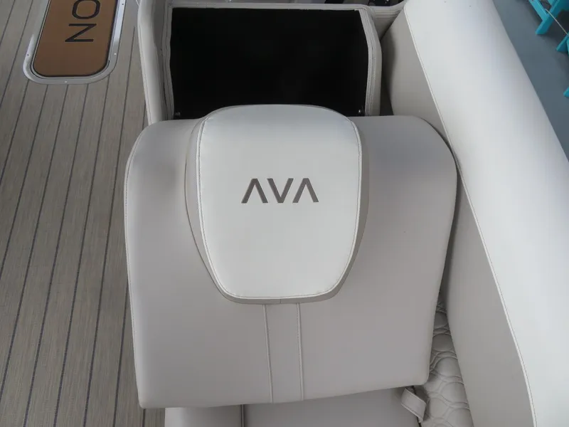 Slide: The Image of Avalon LSZ Quad Lounger 2025 boat seat with logo, featuring sleek white upholstery. - 21