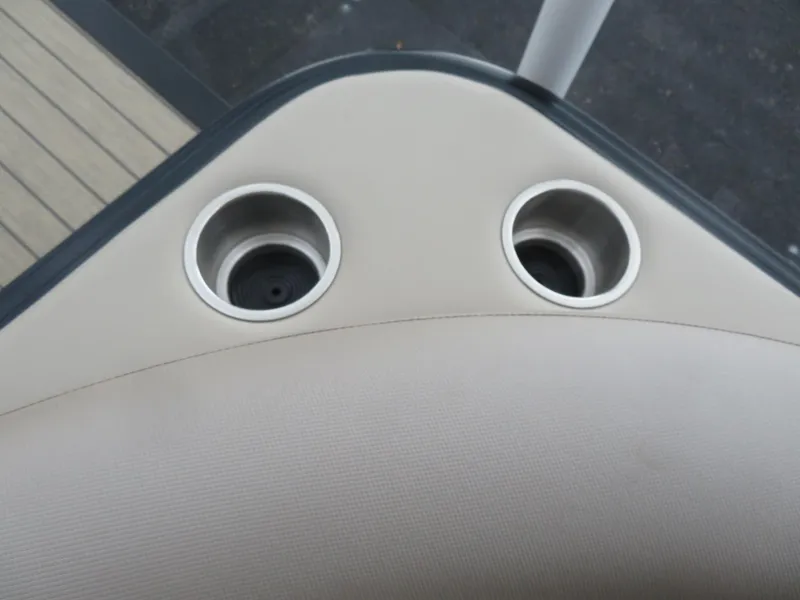 Slide: The Image of Cup holders on Avalon LSZ Quad Lounger 2025 boat, beige upholstery. - 25