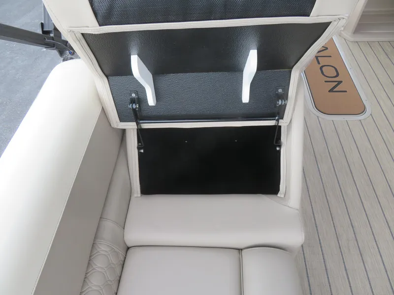 Slide: The Image of 2025 Avalon LSZ Quad Lounger storage compartment with open lid, showcasing interior space. - 28