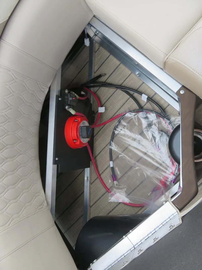 Slide: The Image of 2025 Avalon LSZ Quad Lounger interior wiring and battery compartment. - 29