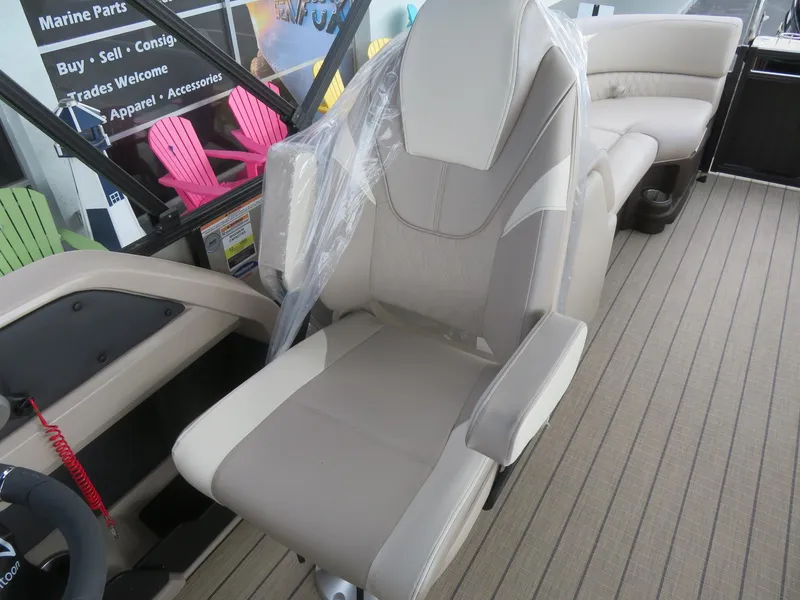 Slide: The Image of 2025 Avalon LSZ Quad Lounger boat seat with beige upholstery on a wooden deck. - 38