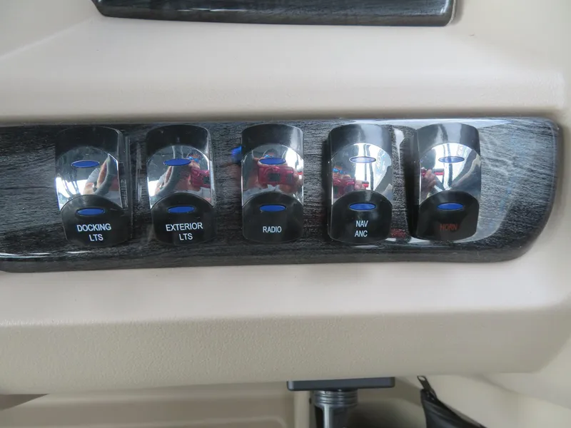 Slide: The Image of Control panel of 2025 Avalon LSZ Quad Lounger with labeled switches for various functions. - 46