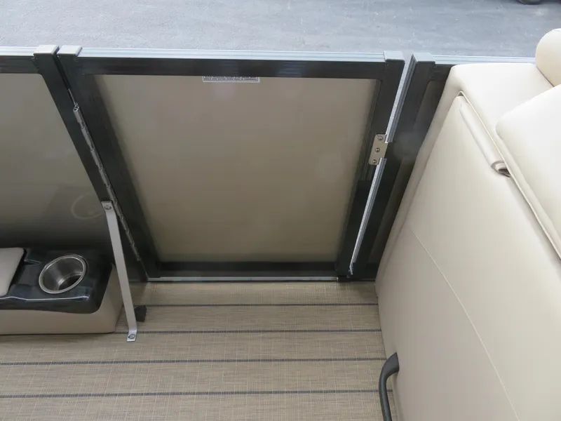 Slide: The Image of 2025 Avalon LSZ Quad Lounger interior with beige seating and cup holder. - 49