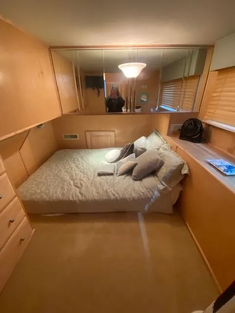 Slide: The Image of Cozy bedroom in 2007 Sharpe 18 x 84 houseboat with wood paneling and soft lighting. - 15