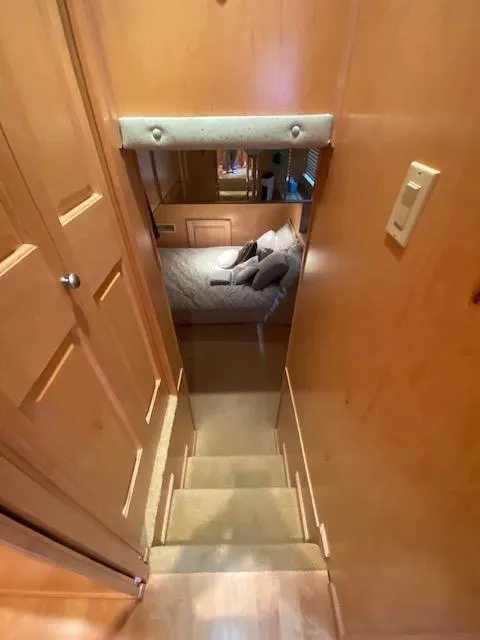 Slide: The Image of Stairway leading to cozy bedroom in 2007 Sharpe 18 x 84 houseboat. - 18