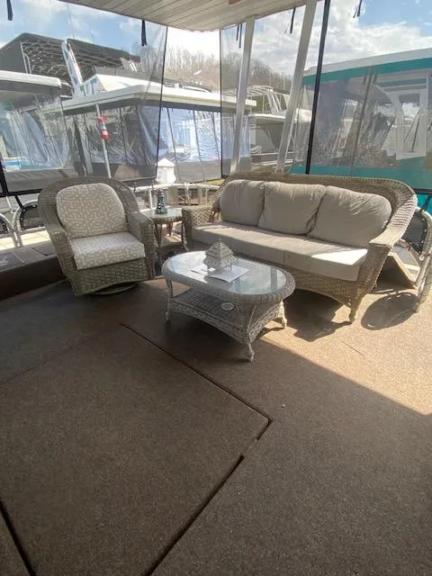 Slide: The Image of Outdoor seating area on 2007 Sharpe 18 x 84 houseboat with wicker furniture. - 2