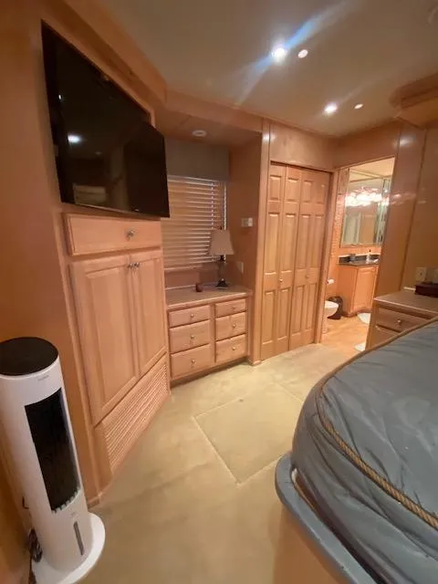 Slide: The Image of Interior of 2007 Sharpe 18 x 84 Houseboat with wood cabinetry and modern amenities. - 23