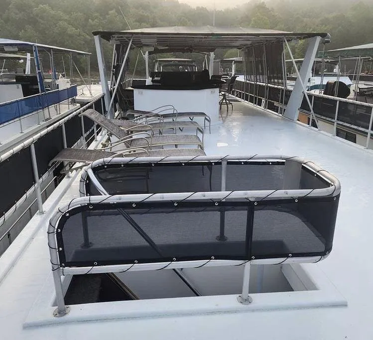 Slide: The Image of 2007 Sharpe 18 x 84 houseboat deck with lounge chairs and canopy. - 33