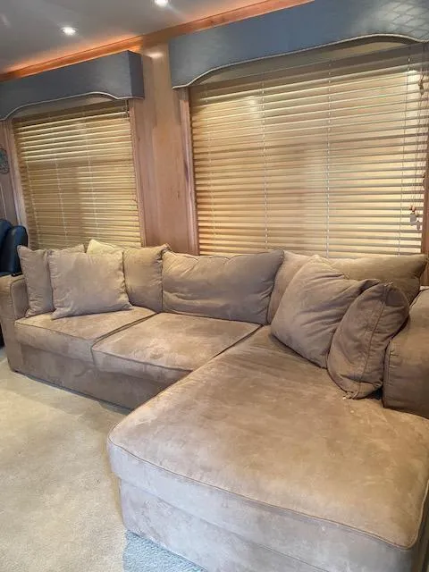 Slide: The Image of Cozy beige sectional sofa in 2007 Sharpe 18 x 84 houseboat interior. - 6