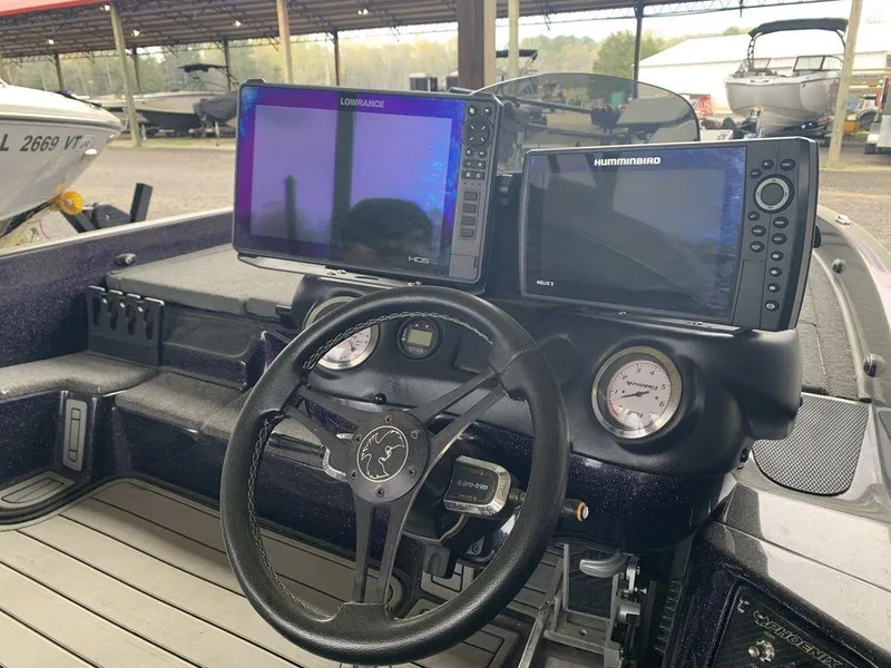 Slide: The Image of 2021 Phoenix Bass Boats 20 PHX dashboard with Lowrance and Humminbird displays. - 3