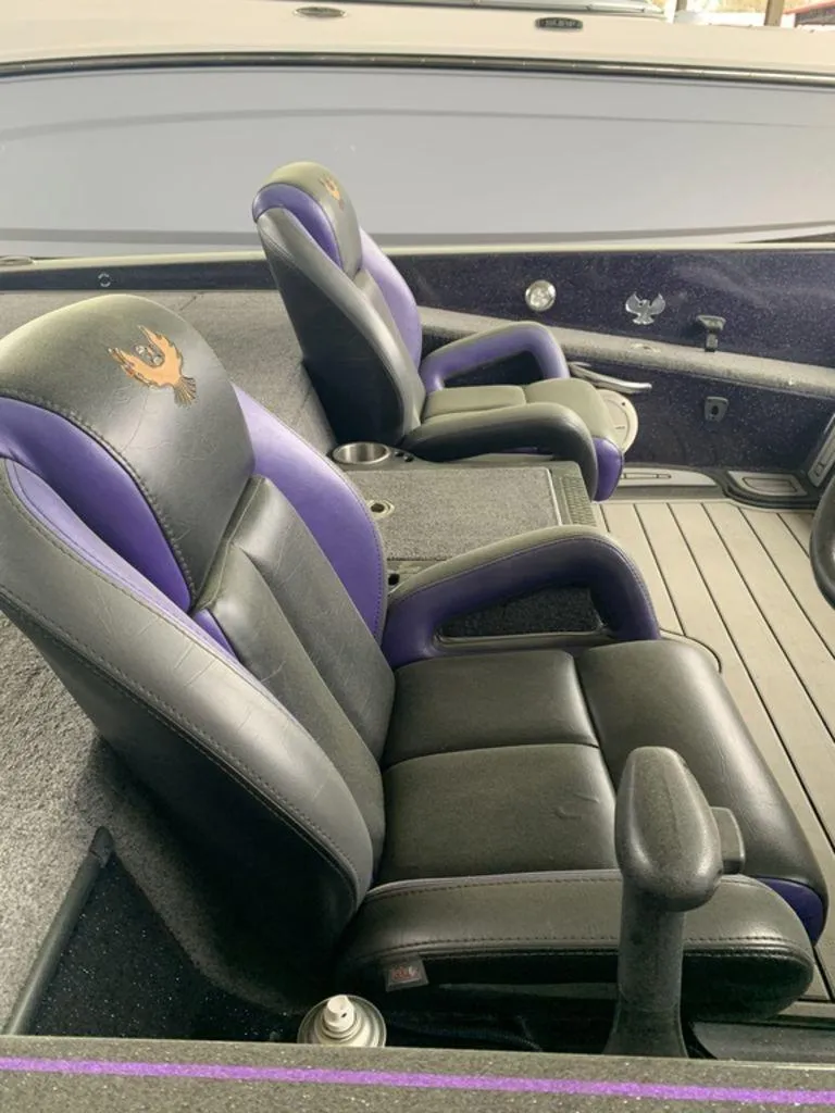 Slide: The Image of 2021 Phoenix Bass Boats 20 PHX interior with black and purple seats. - 4
