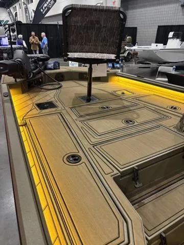 Slide: The Image of 2025 Thor LH1900 DLX Side Console boat with Baystar steering, featuring illuminated deck and seating. - 15