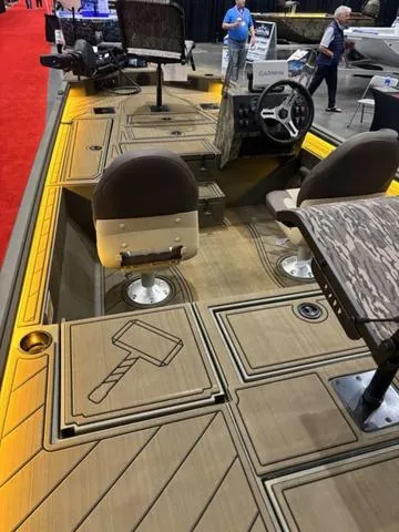 Slide: The Image of 2025 Thor LH1900 DLX Side Console boat with Baystar steering, featuring stylish interior and Thor hammer design. - 17