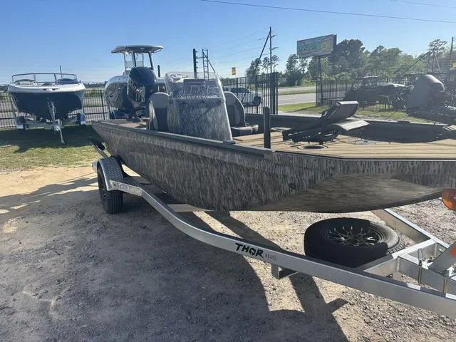 Slide: The Image of 2025 Thor LH1900 DLX boat with Baystar steering, featuring a side console and stylish deck design. - 3