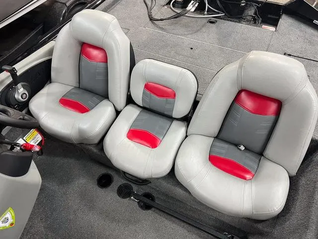 Slide: The Image of 2017 Tracker Pro Team 175 TXW boat seats with red and gray upholstery. - 10
