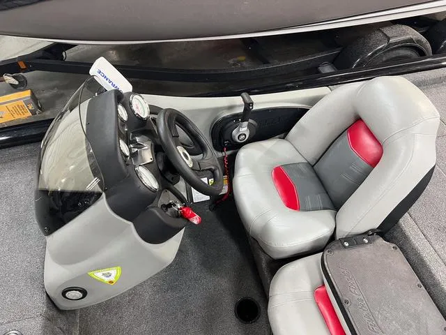Slide: The Image of 2017 Tracker Pro Team™ 175 TXW boat interior with steering console and seats. - 13