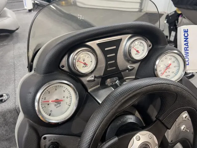 Slide: The Image of Dashboard of 2017 Tracker Pro Team™ 175 TXW boat with gauges and steering wheel. - 15