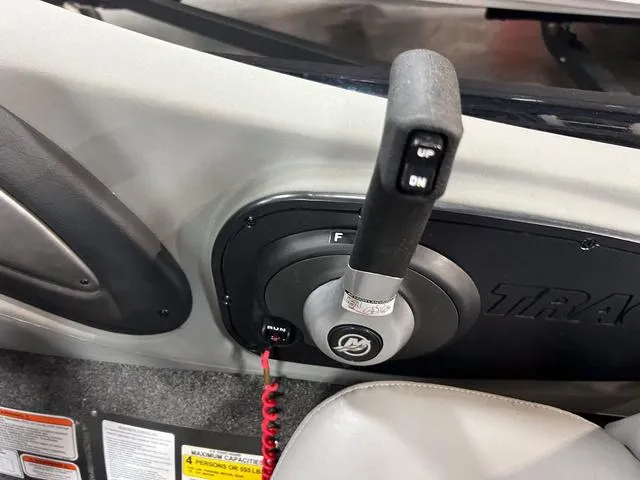 Slide: The Image of Control panel of a 2017 Tracker Pro Team™ 175 TXW boat with throttle lever. - 16