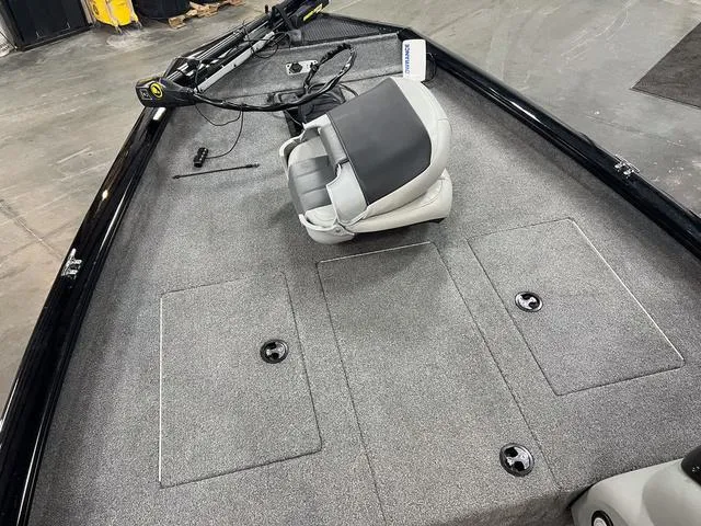 Slide: The Image of 2017 Tracker Pro Team™ 175 TXW boat interior with gray carpet and swivel seat. - 18
