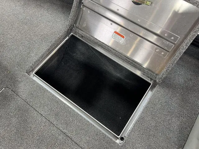 Slide: The Image of Open storage compartment in 2017 Tracker Pro Team™ 175 TXW boat. - 21
