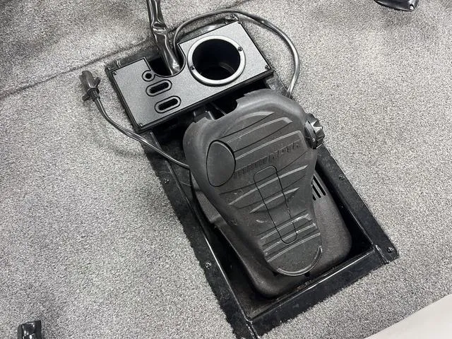 Slide: The Image of Foot pedal control on 2017 Tracker Pro Team™ 175 TXW boat, featuring integrated cup holder. - 23