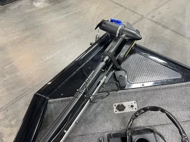 Slide: The Image of 2017 Tracker Pro Team™ 175 TXW boat deck with trolling motor and trailer. - 24