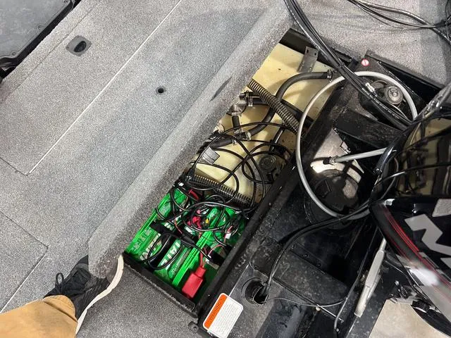 Slide: The Image of 2017 Tracker Pro Team™ 175 TXW boat interior showing battery compartment and wiring. - 6