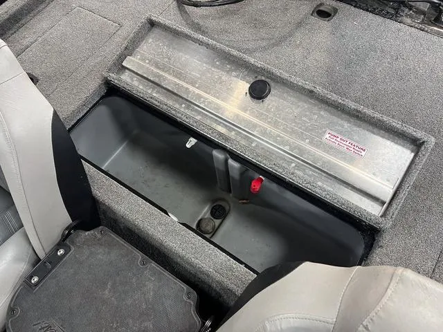 Slide: The Image of 2017 Tracker Pro Team™ 175 TXW boat storage compartment with open lid and seating. - 7