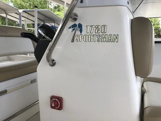 Slide: The Image of 2018 Key West 1720CC Sportsman boat interior with seating and console details. - 3