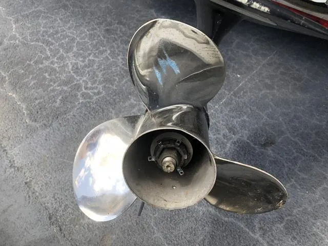 Slide: The Image of 2009 Mako 204 Center Console boat dashboard with steering wheel and navigation instruments. - 11