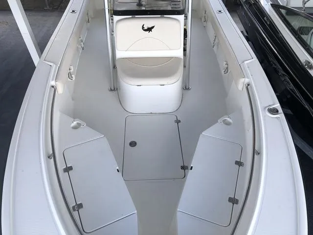 Slide: The Image of 2009 Mako 204 Center Console boat with outboard motor, viewed from above. - 13