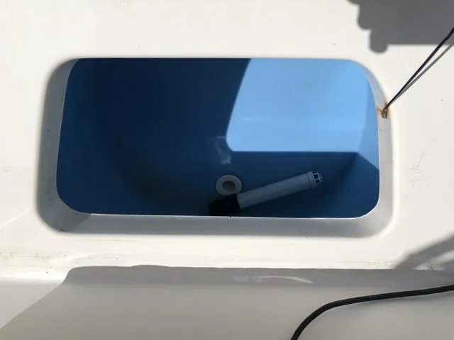 Slide: The Image of Livewell compartment in a 2009 Mako 204 Center Console boat. - 30