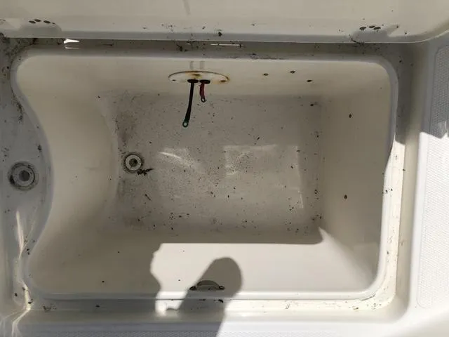 Slide: The Image of Empty storage compartment in a 2009 Mako 204 Center Console boat. - 33