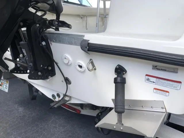 Slide: The Image of 2009 Mako 204 Center Console boat with ladder and motor, rear view. - 9