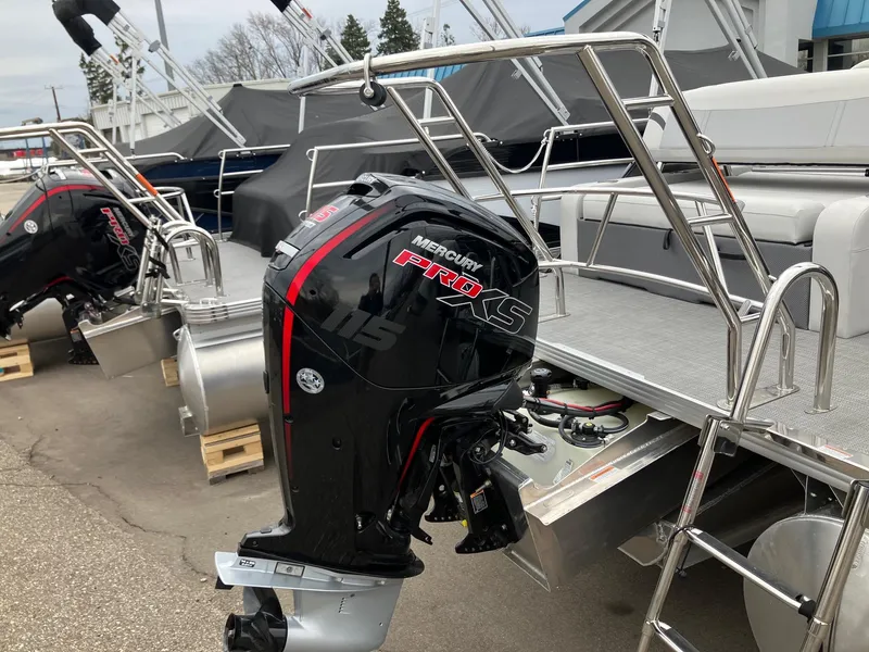 Slide: The Image of 2024 Crest 240 SLSC Classic LX with Mercury Pro XS outboard motor, docked outdoors. - 2