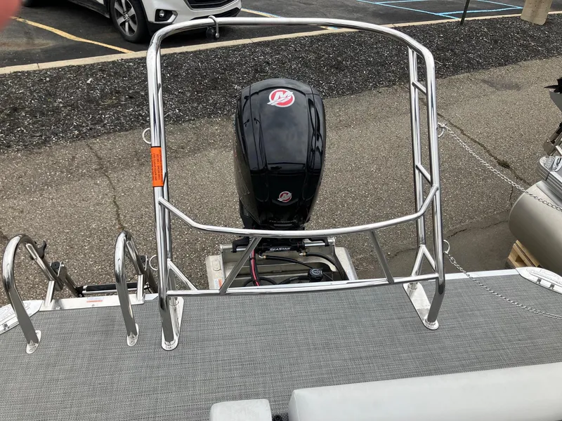 Slide: The Image of 2024 Crest 240 SLSC Classic LX boat with outboard motor and stainless steel railing. - 4