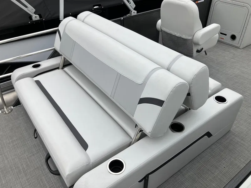 Slide: The Image of 2024 Crest 240 SLSC Classic LX boat interior with gray seating and cup holders. - 5