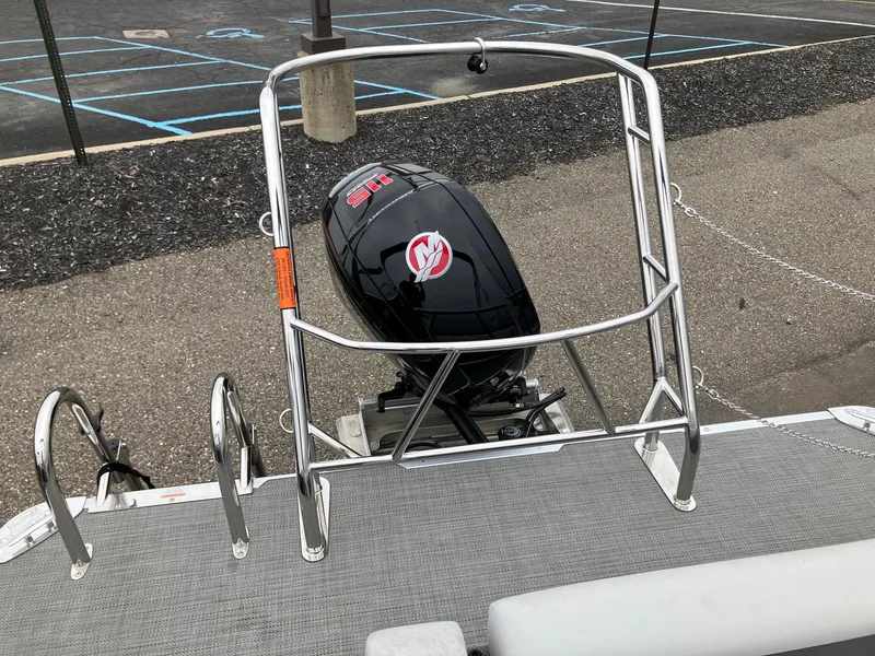 Slide: The Image of 2023 Crest 220 SLC Classic LX boat with outboard motor and safety railing. - 3