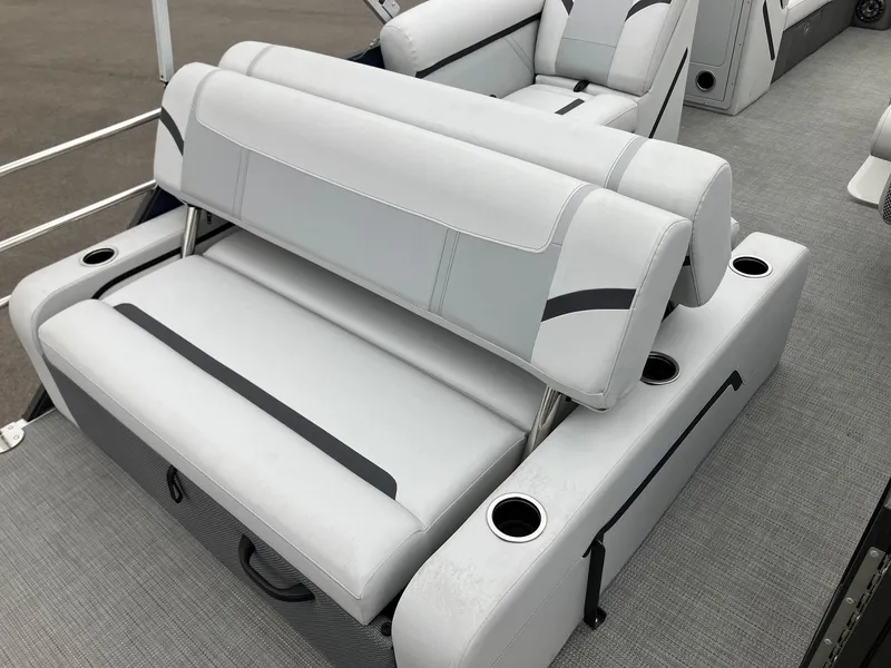 Slide: The Image of 2023 Crest 220 SLC Classic LX boat interior with gray seating and cup holders. - 4