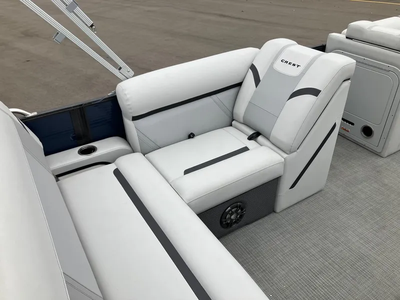 Slide: The Image of 2023 Crest 220 SLC Classic LX boat interior with white and gray seating. - 5