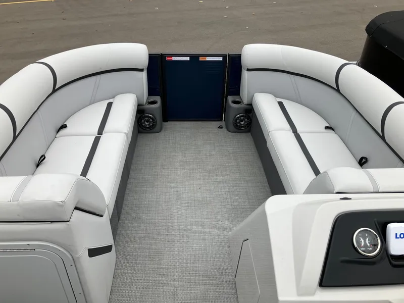 Slide: The Image of 2023 Crest 220 SLC Classic LX pontoon boat interior with gray seating and carpet. - 8