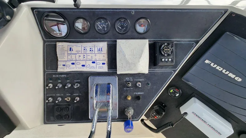 Slide: The Image of Control panel of a 1995 Carver 440 Aft Cabin Motor Yacht with navigation equipment. - 21