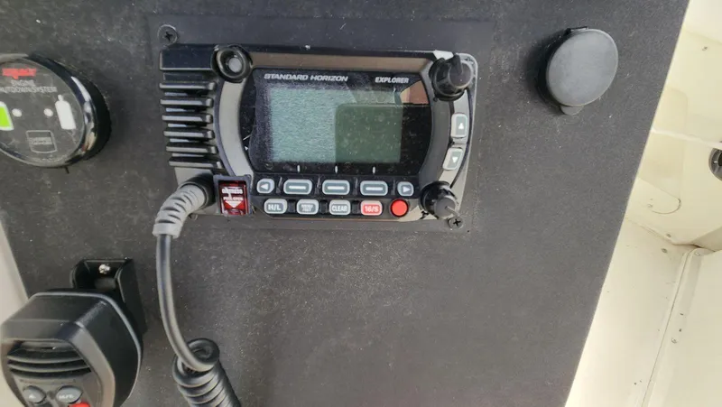 Slide: The Image of 1995 Carver 440 Aft Cabin Motor Yacht radio equipment, featuring Standard Horizon Explorer. - 23