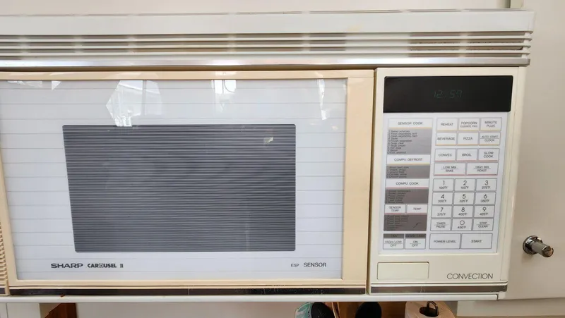 Slide: The Image of Sharp Carousel II microwave with convection settings on a 1995 Carver 440 Aft Cabin Motor Yacht. - 34