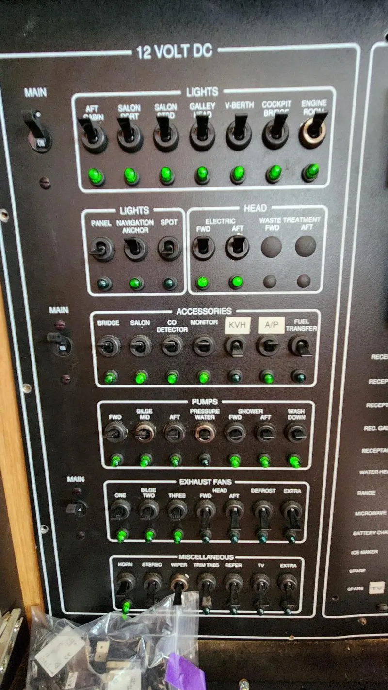 Slide: The Image of Control panel of a 1995 Carver 440 Aft Cabin Motor Yacht with labeled switches. - 48