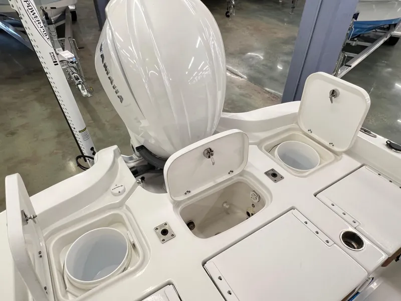 Slide: The Image of 2022 Sea Hunt BX25FS boat with Yamaha engine and storage compartments. - 5