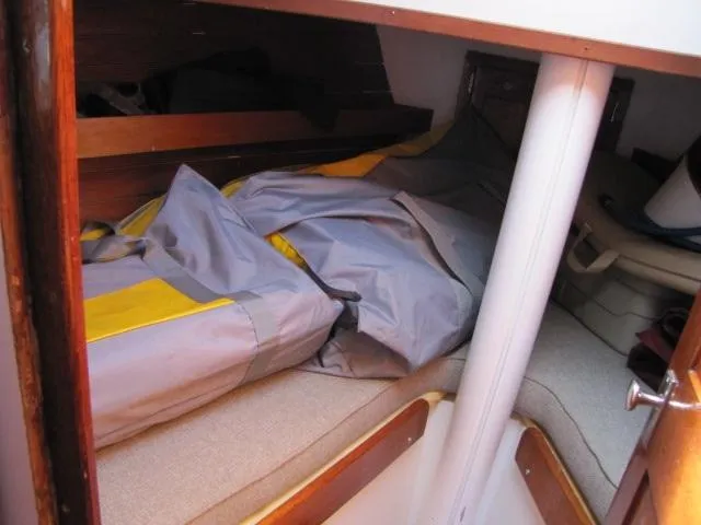 Slide: The Image of Cozy cabin interior of 1974 Custom Lazy Jack 32 sailboat with stored gear. - 17