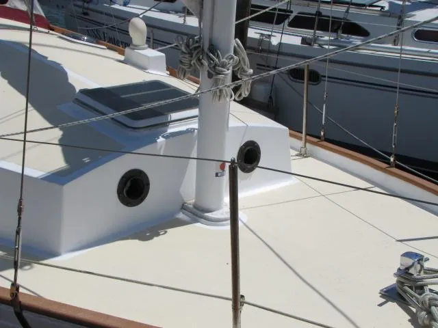 Slide: The Image of Sailboat deck of 1974 Custom Lazy Jack 32, featuring mast and rigging details. - 8