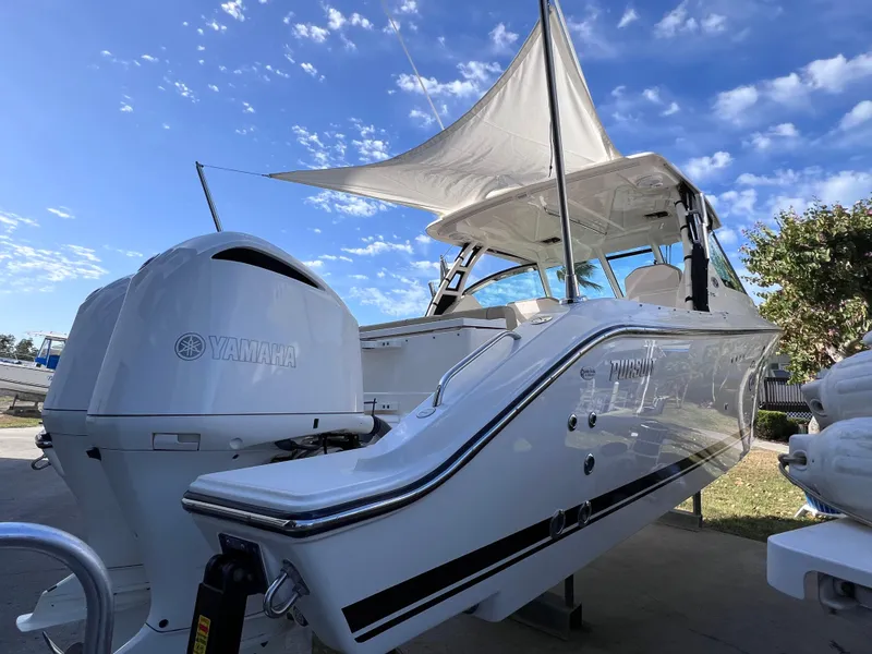 Slide: The Image of 2016 Pursuit DC 295 Dual Console boat with twin Yamaha 300 engines, clean condition. - 18