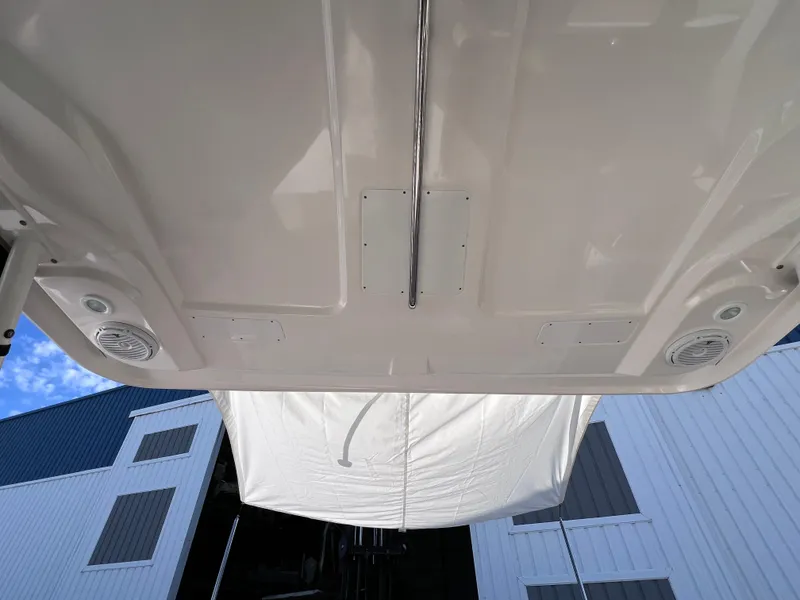 Slide: The Image of 2016 Pursuit DC 295 boat underside view with twin Yamaha 300 engines. - 22